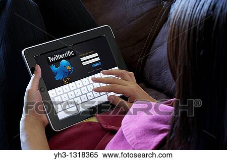 A woman using a Twitter application on her iPad View Large Photo Image Stock Photography - A woman using a Twitter application on her iPad. Fotosearch