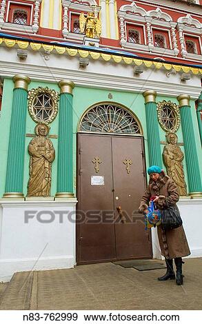 A woman visits the chapel at Ressurection Gate Moscow Russia View Large Photo Image Stock Photo - A woman visits the chapel at Ressurection Gate Moscow Russia. Fotosearch