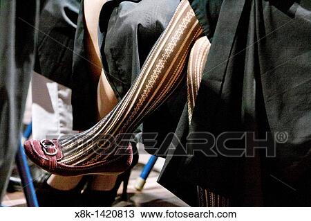 A woman wearing patterned stockings indoors View Large Photo Image Stock Image - A woman wearing patterned stockings indoors. Fotosearch
