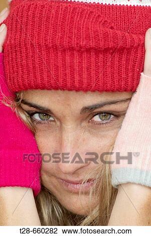 A woman with a wool red cap View Large Photo Image Stock Image - A woman with a wool red cap. Fotosearch