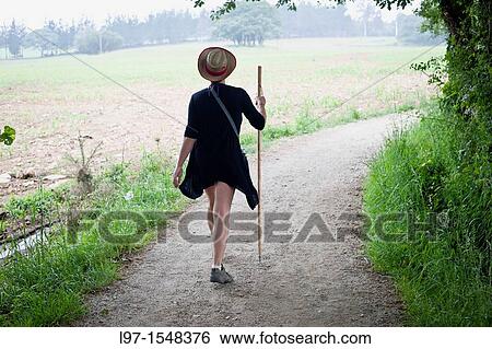 A women walking the Camino de Santiago near the village of Casanova View Large Photo Image Stock Photograph - A women walking the Camino de Santiago near the village of Casanova. Fotosearch