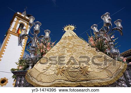 Stock Photography - A wooden statue of the Virgin Carmen is publicly displayed during a Holy Week procession in the town of Prado del Rey in southern Spain's Cadiz Sierra region in Andalucia, April 24, 2008. Fotosearch