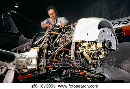 A worker assembling electrical components of a turbo-prop engine View Large Photo Image Stock Photography - A worker assembling electrical components of a turbo-prop engine. Fotosearch