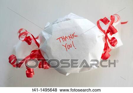 A wrapped gift with the words? Thank You? on it View Large Photo Image Stock Photo - A wrapped gift with the words? Thank You? on it. Fotosearch