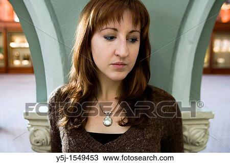 A youjng Caucasian female appearing melancholic and depressed View Large Photo Image Stock Image - A youjng Caucasian female appearing melancholic and depressed. Fotosearch