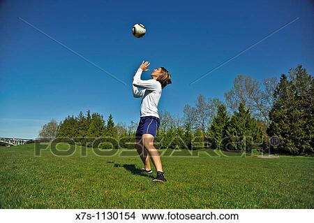 A young and atheletic Caucasian male soccer player View Large Photo Image Picture - A young and atheletic Caucasian male soccer player. Fotosearch