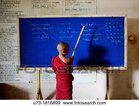A young Buddhist monk in his classroom. View Large Photo Image Stock Photo - A young Buddhist monk in his classroom.. Fotosearch