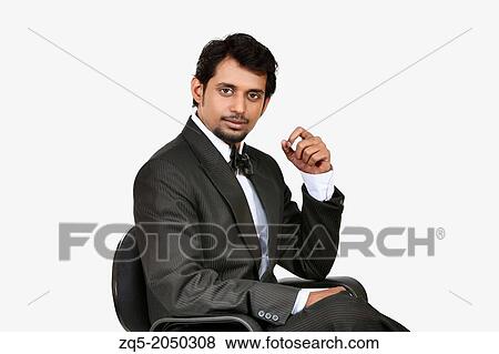 Stock Photo - A young business man thinking. Pune India. Fotosearch