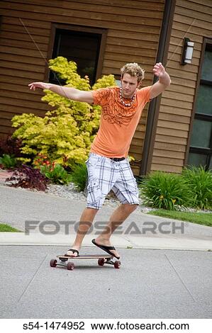 A young, caucasian male with a longboard skateboard View Large Photo Image Stock Image - A young, caucasian male with a longboard skateboard. Fotosearch