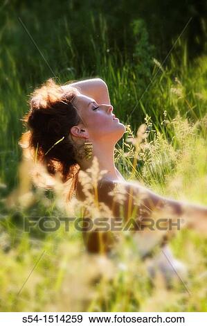 A young caucasian woman outdoors in a park in Spokane, Washington, USA. View Large Photo Image Stock Photo - A young caucasian woman outdoors in a park in Spokane, Washington, USA.. Fotosearch