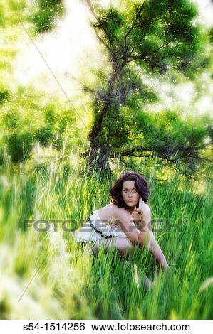 A young caucasian woman outdoors in a park in Spokane, Washington, USA. View Large Photo Image Stock Photograph - A young caucasian woman outdoors in a park in Spokane, Washington, USA.. Fotosearch