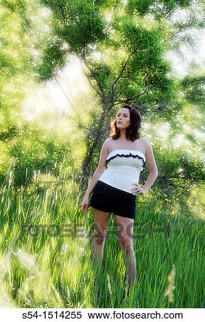 A young caucasian woman outdoors in a park in Spokane, Washington, USA. View Large Photo Image Stock Photography - A young caucasian woman outdoors in a park in Spokane, Washington, USA.. Fotosearch