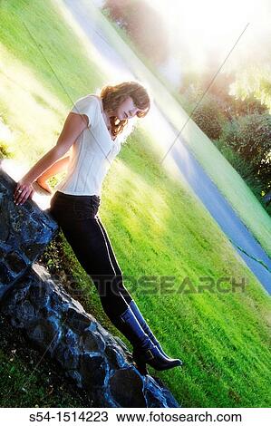 A young caucasian woman outdoors. View Large Photo Image Stock Image - A young caucasian woman outdoors.. Fotosearch
