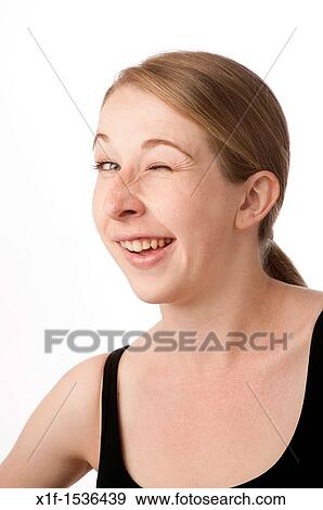 a young caucasian woman winking View Large Photo Image Stock Photo - a young caucasian woman winking. Fotosearch