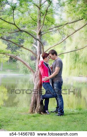 Stock Image - A young couple outdoors. Fotosearch