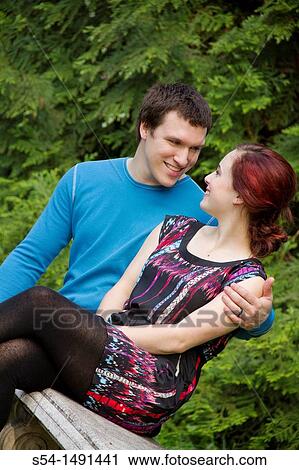 Stock Image - A young couple outdoors. Fotosearch