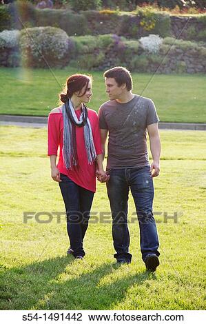 Stock Image - A young couple outdoors. Fotosearch