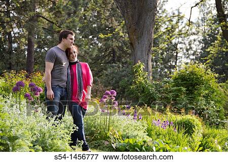 A young couple outdoors View Large Photo Image Stock Photo - A young couple outdoors. Fotosearch