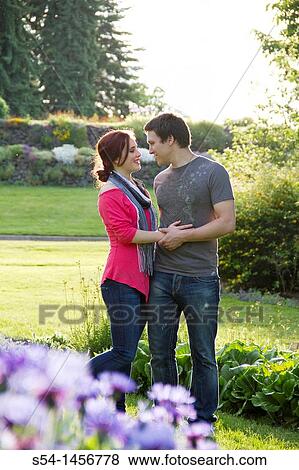 Stock Photo - A young couple outdoors. Fotosearch
