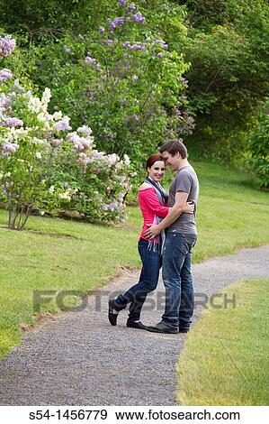 Stock Photo - A young couple outdoors. Fotosearch