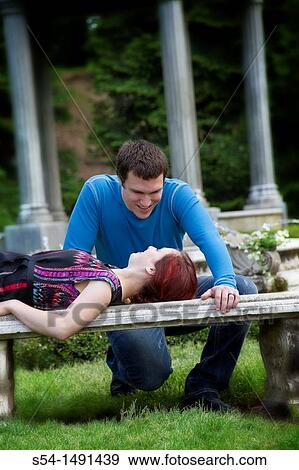 A young couple outdoors View Large Photo Image Stock Photo - A young couple outdoors. Fotosearch