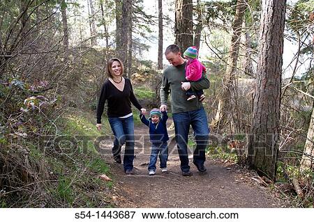 Stock Photo - A young family walking at Tubbs Hill, Coeur d? Alene, Idaho, USA.. Fotosearch