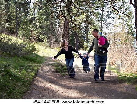 A young family walking at Tubbs Hill, Coeur d? Alene, Idaho, USA. View Large Photo Image Stock Photo - A young family walking at Tubbs Hill, Coeur d? Alene, Idaho, USA.. Fotosearch