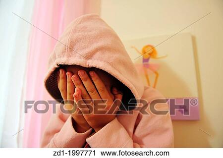 A young girl who is a victim of domestic violence cries on her bed in her bedroom. View Large Photo Image Stock Image - A young girl who is a victim of domestic violence cries on her bed in her bedroom.. Fotosearch