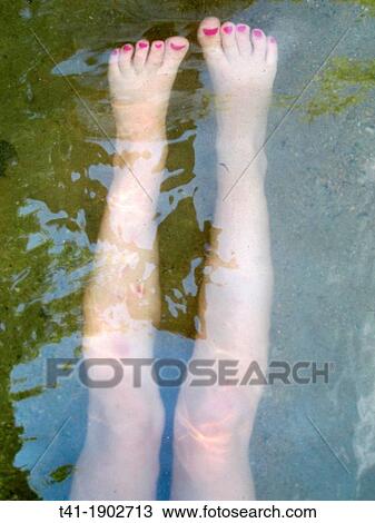 A young girl's legs underwater View Large Photo Image Stock Image - A young girl's legs underwater. Fotosearch