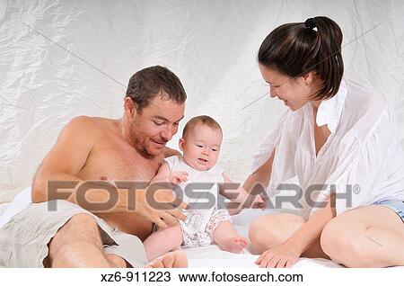 a young happy family View Large Photo Image Stock Image - a young happy family. Fotosearch