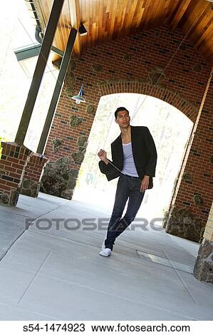A young hispanic male outdoors near a shopping center in Spokane, Washington, USA. View Large Photo Image Stock Image - A young hispanic male outdoors near a shopping center in Spokane, Washington, USA.. Fotosearch