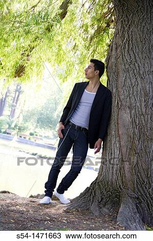 A young hispanic male outdoors. View Large Photo Image Stock Image - A young hispanic male outdoors.. Fotosearch