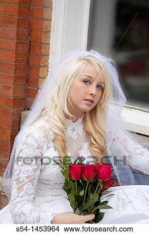Picture - A young lady in a bridal dress. Fotosearch