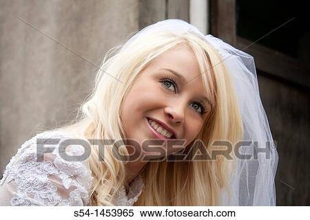 A young lady in a bridal dress View Large Photo Image Stock Photography - A young lady in a bridal dress. Fotosearch