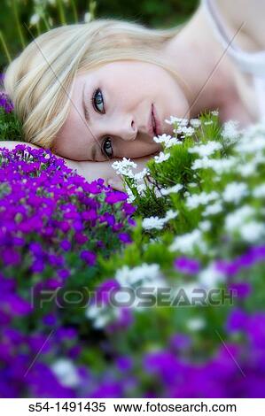 A young lady in a flower garden. View Large Photo Image Stock Photography - A young lady in a flower garden.. Fotosearch