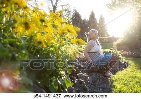 A young lady in a park View Large Photo Image Stock Photo - A young lady in a park. Fotosearch