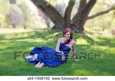 A young lady in prom clothes at the park. View Large Photo Image Stock Image - A young lady in prom clothes at the park.. Fotosearch