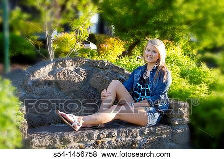 A young lady outdoors View Large Photo Image Stock Photo - A young lady outdoors. Fotosearch