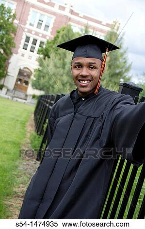 A young male graduate View Large Photo Image Stock Photography - A young male graduate. Fotosearch