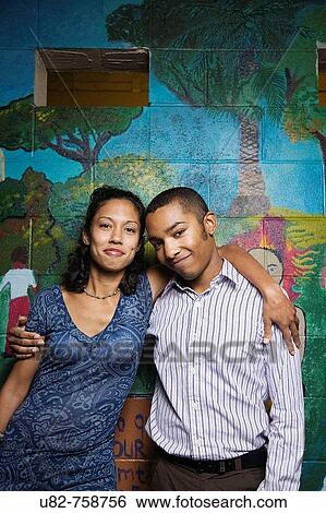 A young man and young woman in front of a wall mural, Berkeley, California, USA View Large Photo Image Stock Photograph - A young man and young woman in front of a wall mural, Berkeley, California, USA. Fotosearch