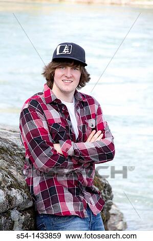 A young man outdoors View Large Photo Image Stock Photo - A young man outdoors. Fotosearch