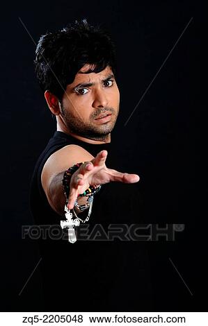 A young man ready to grab anything, Pune, India. View Large Photo Image Stock Photo - A young man ready to grab anything, Pune, India.. Fotosearch