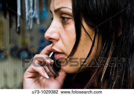 A young Palestinian woman talking on her mobile phone. View Large Photo Image Stock Image - A young Palestinian woman talking on her mobile phone.. Fotosearch