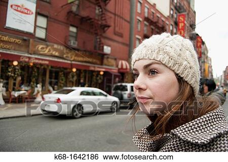 A young woman, 20, on a street in New York City, NY, USA View Large Photo Image Stock Photograph - A young woman, 20, on a street in New York City, NY, USA. Fotosearch