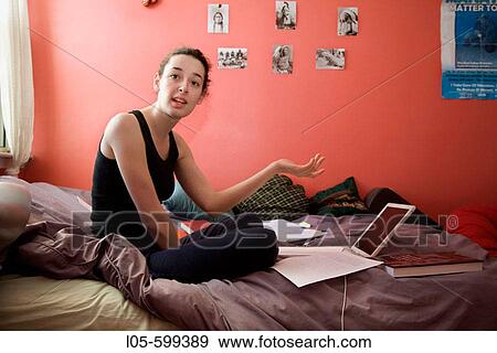 A Young Woman 20 Years Old In Her Bedroom Stock Photo