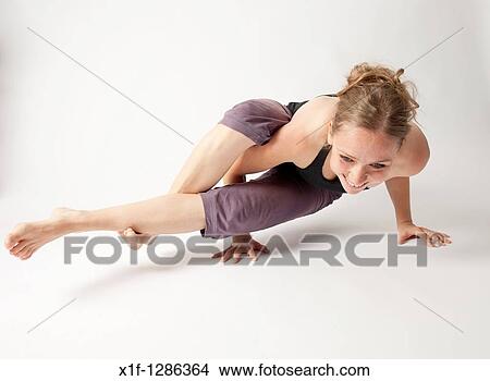 A young woman doing yoga View Large Photo Image Picture - A young woman doing yoga. Fotosearch