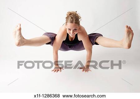A young woman doing yoga View Large Photo Image Stock Photo - A young woman doing yoga. Fotosearch