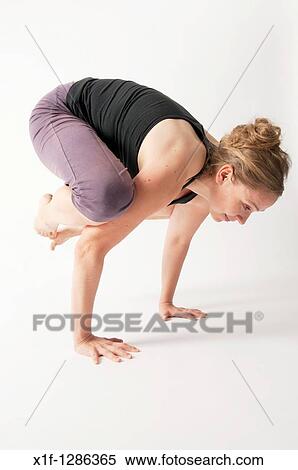A young woman doing yoga View Large Photo Image Stock Photography - A young woman doing yoga. Fotosearch