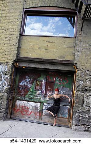 Stock Photo - A young woman downtown in Spokane, Washington, USA. Fotosearch