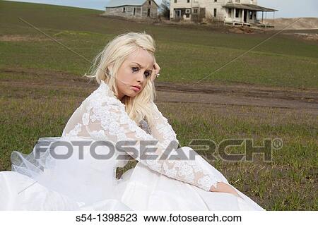 A young woman in a bridal gown, sitting in a field and crying near Rosalia, Washington, USA. View Large Photo Image Stock Image - A young woman in a bridal gown, sitting in a field and crying near Rosalia, Washington, USA.. Fotosearch